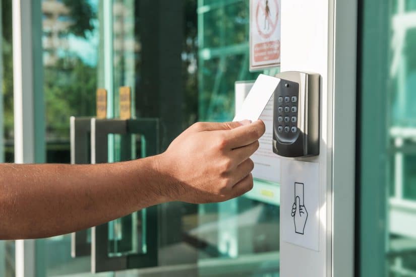 Person Putting A Card On An Electronic Lock