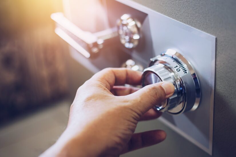 Photo of a Man Opening a Safe