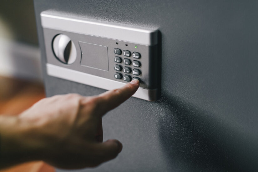 Photo of a Man Opening a Safe